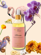 Gylden og nærende Bloom Kropsolie med æteriske olier fra jasmin og grapefrugt, ideel til daglig kropspleje eller som beroligende badeolie.